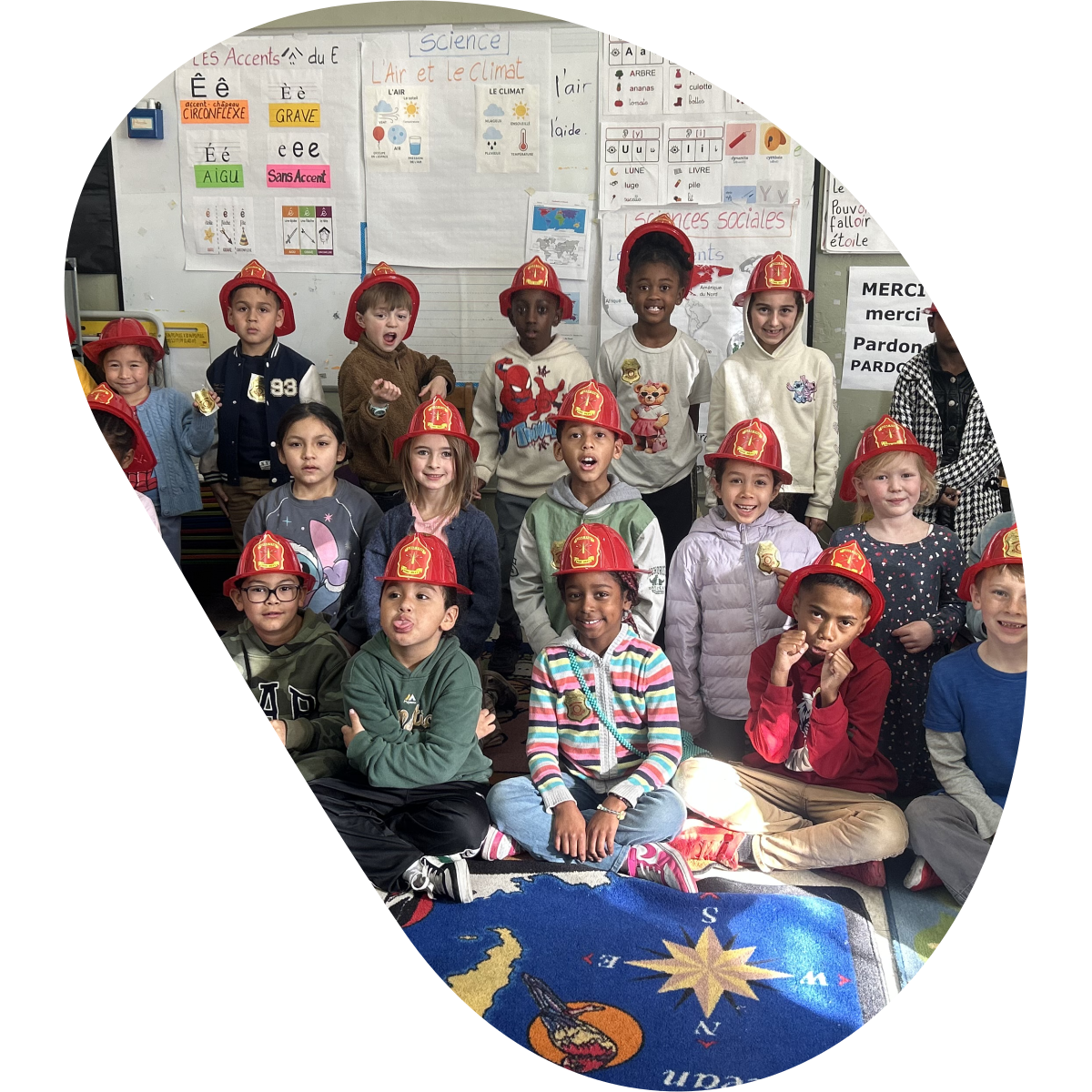 Francophone students wearing firefighter hats in their classroom